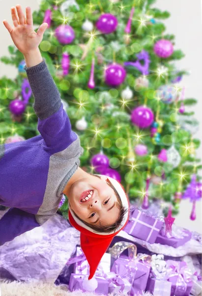 Happy boy near Christmas tree — Stock Photo, Image