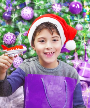 Boy enjoying Christmas gift clipart