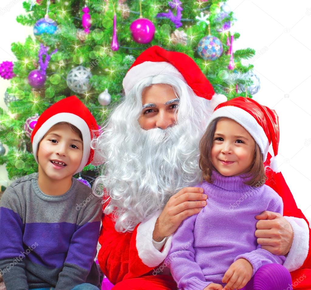 Adorable kids with Santa Claus