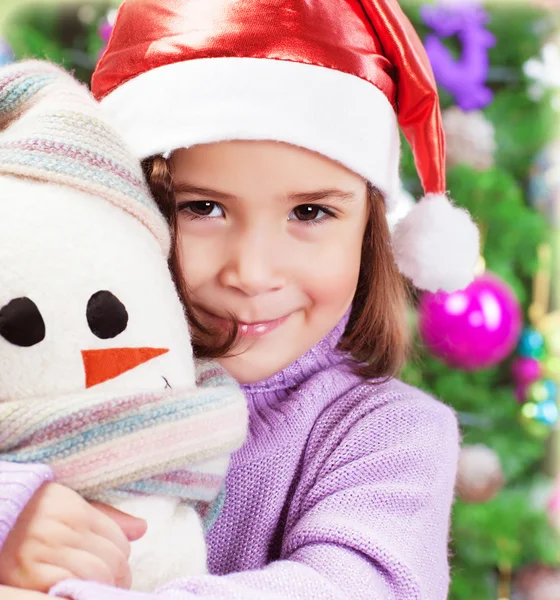 Little girl in Santa hat Stock Image