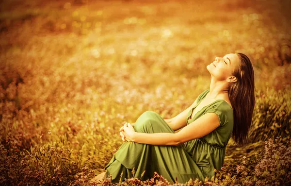 Romantic woman on golden field — Stock Photo, Image