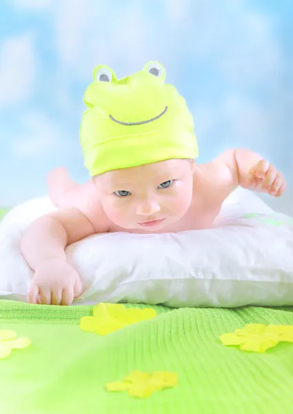 Little baby in frog costume — Stock Photo, Image