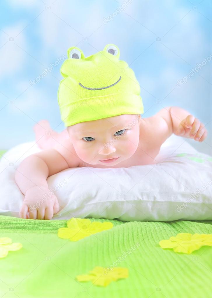 Little baby in frog costume