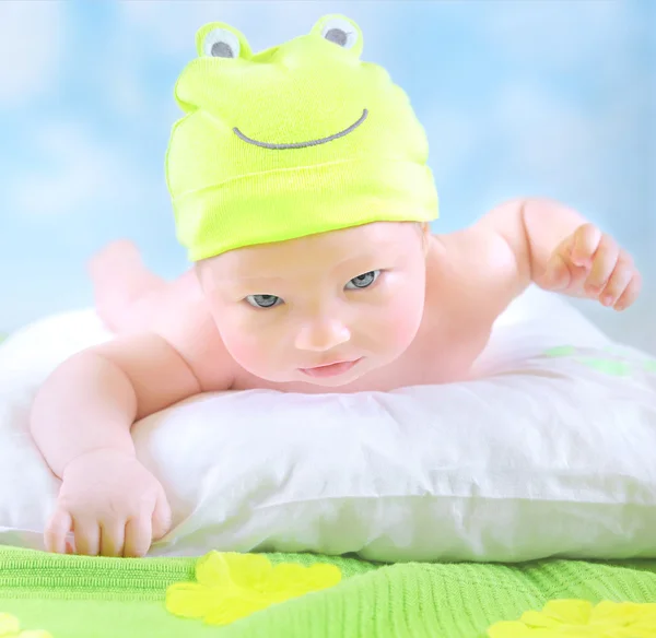 Little baby in frog costume — Stock Photo, Image