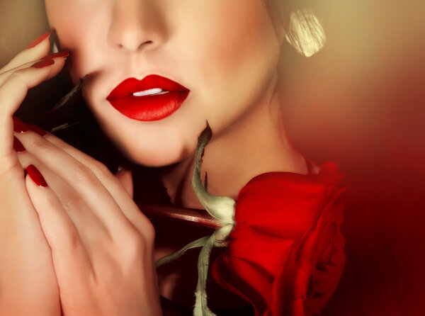 Closeup portrait of sexy gorgeous woman with red lipstick and red rose, half face, luxury beauty salon, seduction concept