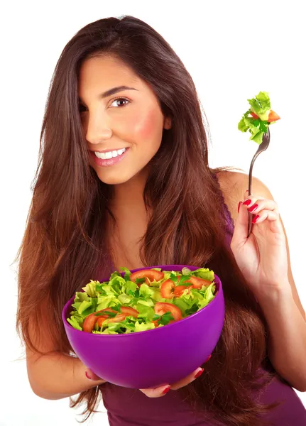 Sportive girl eating fresh salad — Stock Photo, Image