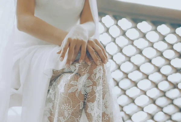 Closeup Photo of a Bridal Dress Details. Gorgeous White Lace Finery. Waiting for a Ceremony. The Happiest Day. Fashion Bridal Look.