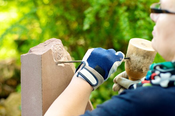 Female stonemason at work