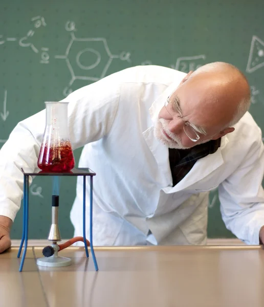 Working in a laboratory with a Bunsen burner — Stock Photo, Image