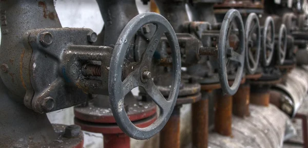 Old pipes with valves — Stock Photo, Image