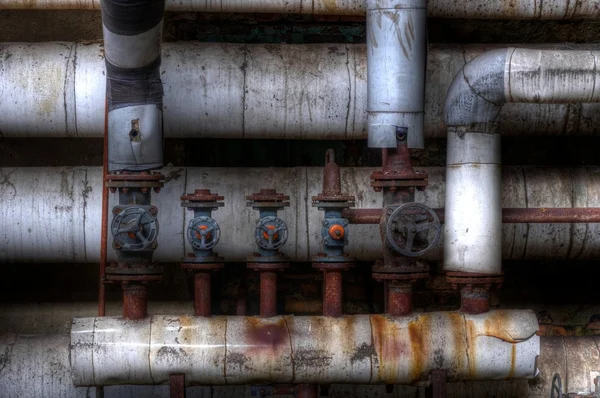 Old pipes with valves — Stock Photo, Image