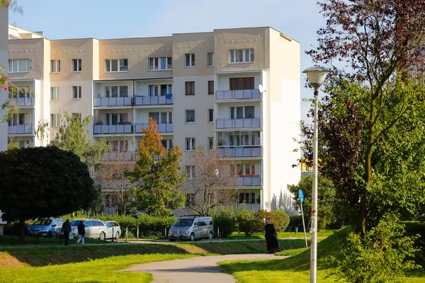 stock image Warsaw, Poland - October 11, 2021: A residential building next to which several cars have been parked is seen in the Goclaw estate. Recreation areas with trees and other plants are nearby