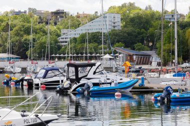 Gdynia, Poland - June 3, 2022: Various boats, motorboats and sailboats are moored in the marina located at the southern pier of the port of Gdynia on the Baltic Sea in the Bay of Gdans