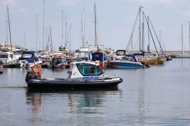 Gdynia, Poland - June 3, 2022: Various boats, motorboats and sailboats are moored in the marina located at the southern pier of the port of Gdynia on the Baltic Sea in the Bay of Gdansk