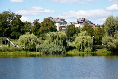 Warsaw, Poland - August 7, 2022: Overall view of the park and lake in the Goclaw estate, in the Praga Poludnie district.