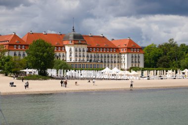 Sopot, Poland - May 31, 2022: The five-star Grand Hotel by the Baltic Sea with its own sandy beach. The building in which this hotel is located dates back to 192