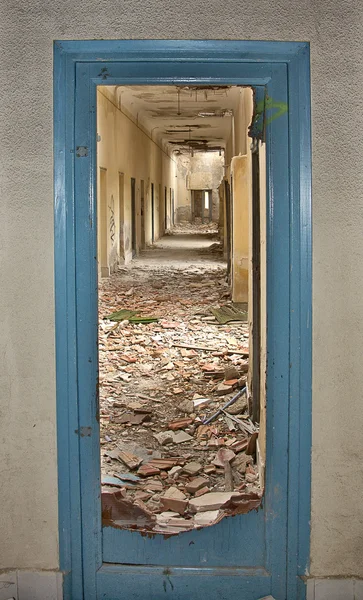 Door shattered by the blast of an explosion — Stock Photo, Image