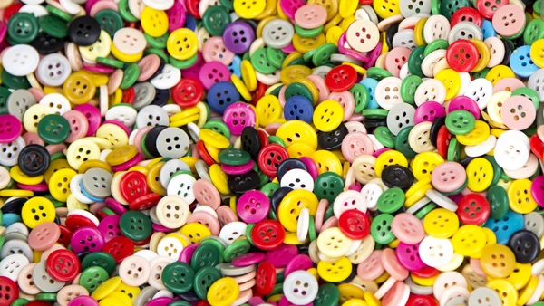 Background or texture of a pile of buttons of many colors and si — Stock Photo, Image