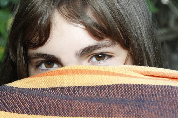 Shameful girl pokes her eyes after a fabric — Stock Photo, Image