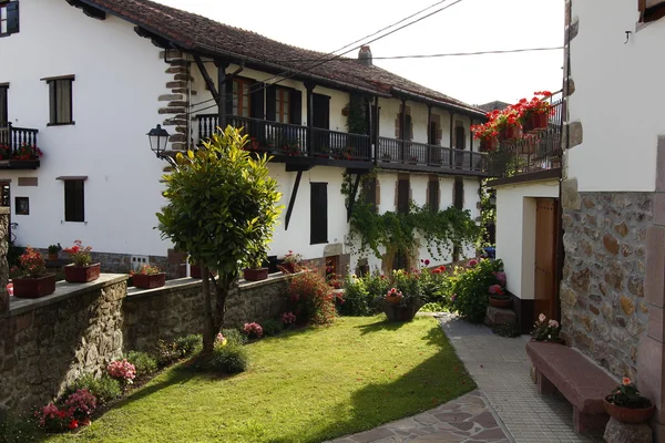 Stone houses and ornate wood very typical in the beautiful villa — Stock Photo, Image