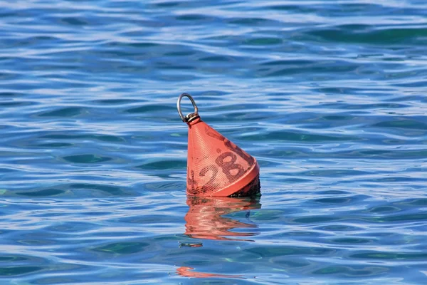Fishing buoy in the blue sea — Stock Photo, Image