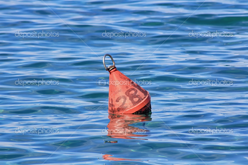 Fishing buoy in the blue sea — Stock Photo © James633 #33380603