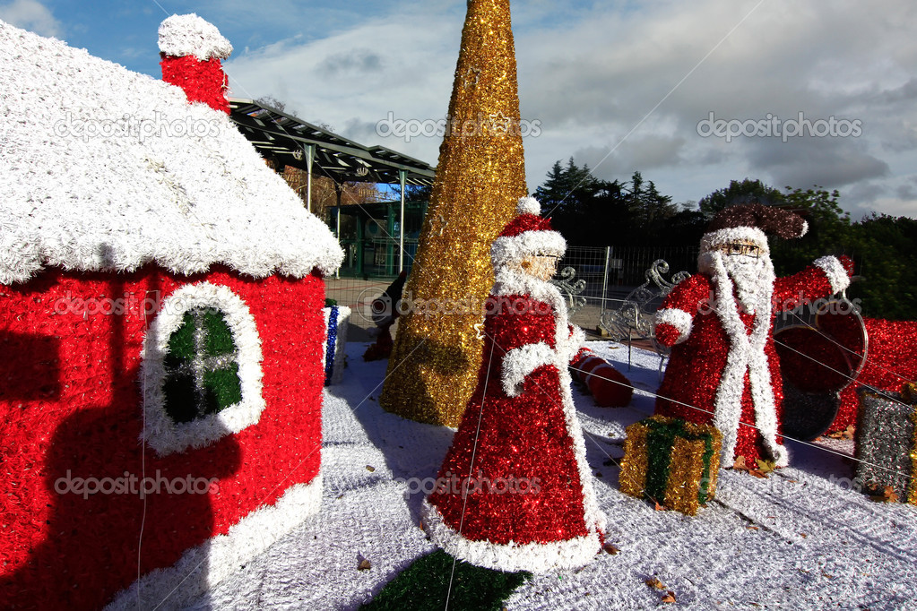 great figures of Santa Claus at the street during christmas