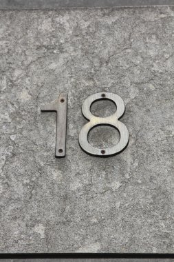 Number eighteen on a wall