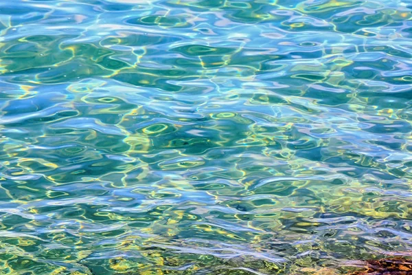Antecedentes Ondas texturizadas en mar tranquilo — Foto de Stock
