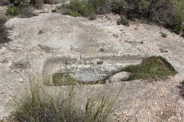 Tumbas celtas antiguas talladas en la roca — Foto de Stock