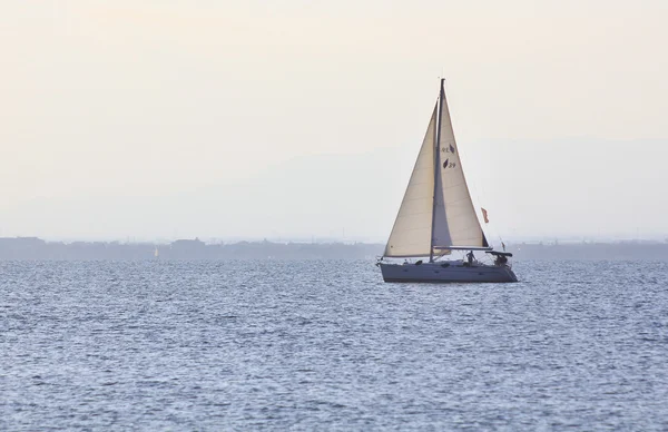 Sailboat sailing at sunset — Stock Photo, Image