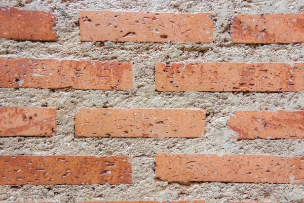 Achtergrond van rode bakstenen muur met cement — Stockfoto