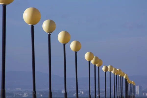 Row of lampposts in perspective — Stock Photo, Image