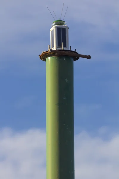 Small lighthouse guide entry into port — Stock Photo, Image