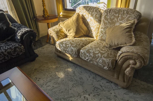 elegant antique sofas with big cushions
