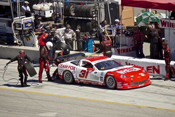 Corvette in pit stop at Grand AM Rolex Races on Mazda Laguna Seca Raceway — Stock Photo, Image