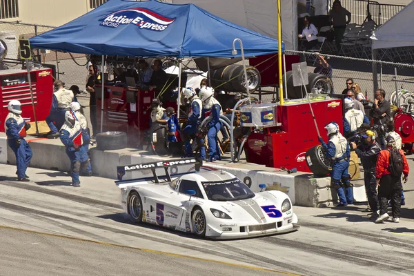 Corvette CanAm leaving pit stop at Grand AM Rolex Races on Mazda Laguna Seca Raceway — Stock Photo, Image