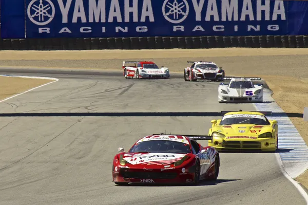 High speed corner turn at Grand AM Rolex Races on Mazda Laguna Seca Raceway — Stock Photo, Image