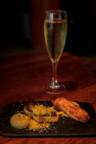 Foie gras and truffle cream pintxos with cava in San Sebastian Donostia, Spain — стокове фото