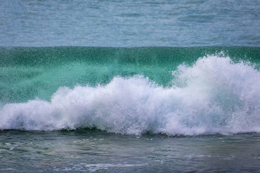 Powerful Pacific Ocean wave breaking by the beach in Southern California