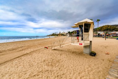Laguna Beach, United States - January 22, 2021: Lifeguard on duty at the famous tourist destination beach in California on a cloudy day