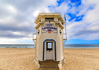 Vintage lifeguard station in Laguna Beach, famous tourist destination in California, Pacific Ocean in the background a on a cloudy day