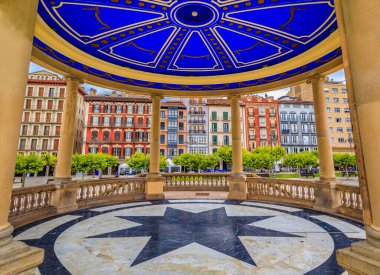 Historic Plaza del Castillo with restaurants and a central domed gazebo in Old Town, famous for running of the bulls in Pamplona, Spain clipart