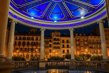 Domed gazebo illuminated at night on historic central Plaza del Castillo in Old Town, Pamplona, Spain famous for running of the bulls