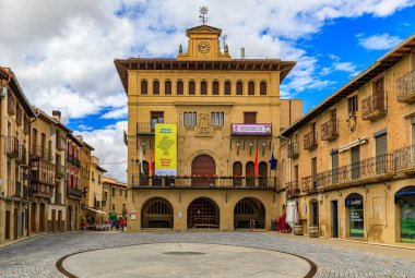 Olite, Spain - June 23, 2021: City Council building and medieval houses on Plaza de los Teobaldos square in the town famous for a Royal Palace castle