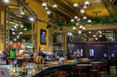 Pamplona, Spain - June 21, 2021: Ornate interior of historic coffee shop Iruna frequented by Ernest Hemingway on Plaza del Castillo square in Old Town