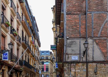 San Sebastian, Spain - June 25, 2021: Basque restaurants and bars famous for pintxos or tapas in the narrow streets, old town Donostia, Basque Country
