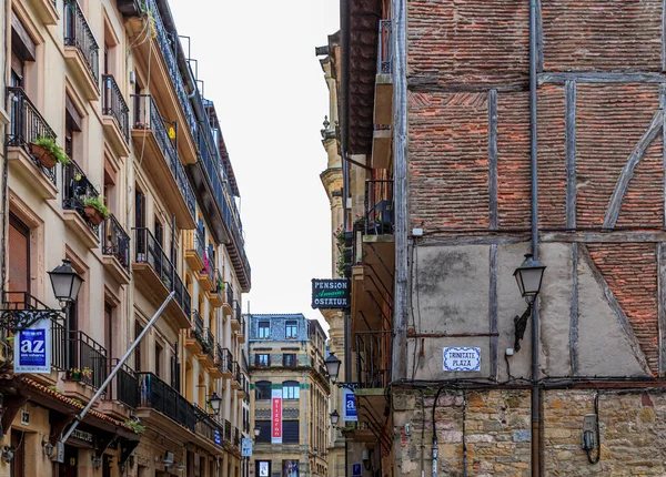 San Sebastian, Spain - June 25, 2021: Basque restaurants and bars famous for pintxos or tapas in the narrow streets, old town Donostia, Basque Country