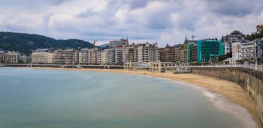 Panorama of La Concha bay and beach in San Sebastian Donostia with the city coastline and waterfront hotels, the Basque Country, Spain, long exposure