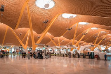 Madrid, Spain - June 28, 2021: Modern architecture inside a terminal in Madrid International Airport, Aeropuerto Madrid Barajas, MAD, COVID travel